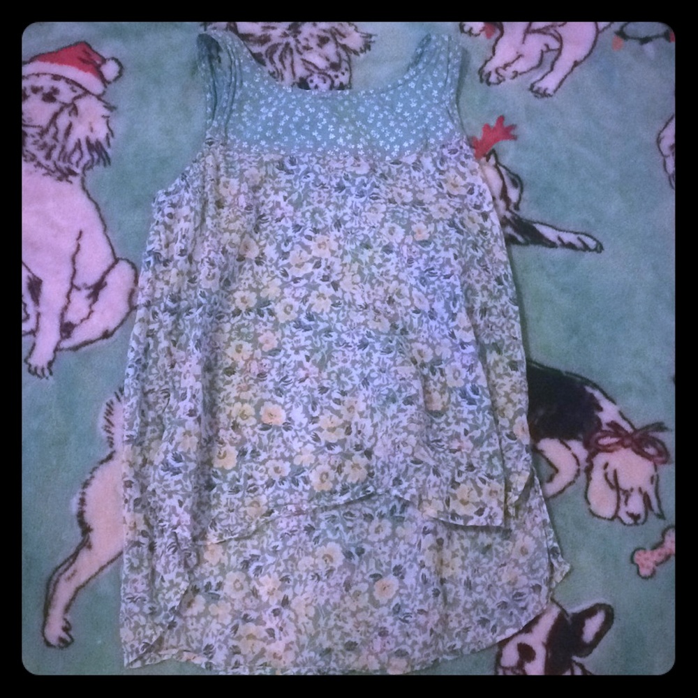 Green shirt with flowers all over it.